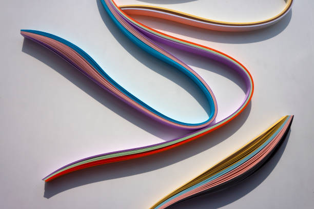 istock Colorful curved papers on white background. 1368807462