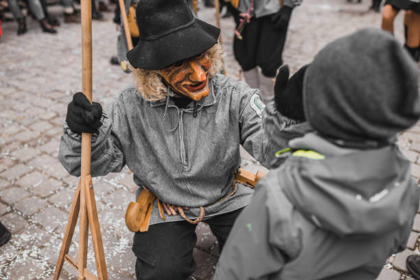 Swabian Fasnet - Colorful carnival Tuebingen, Germany - February 09, 2020: Swabian Fasnet - Colorful carnival procession on the street of the old town of Tübingen - Swabian-Alemannic Fasnet is a pagan affair with old traditions fasnacht festival stock pictures, royalty-free photos & images