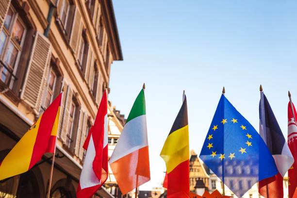 EU quarantine due to coronavirus epidemic - Set of European flags hanging on building with EU and UN flags in Strasbourg, Flance