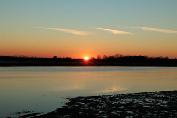 istock sundown with clear sky over the water 1368810692