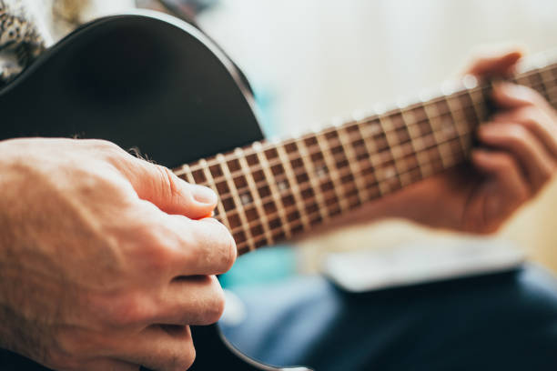 istock Playing the guitar - finger style 1368811840