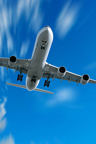istock jet airplane landing in motion blur sky 136881555