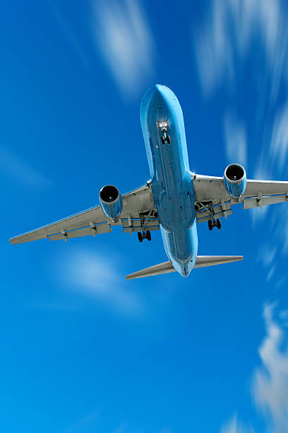 istock jet airplane landing in motion blur sky 136881598