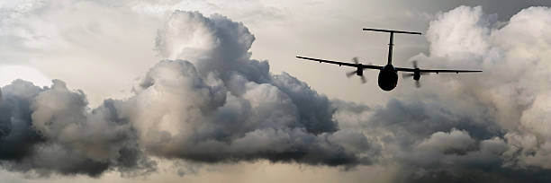 istock propeller airplane flying in storm 136881635