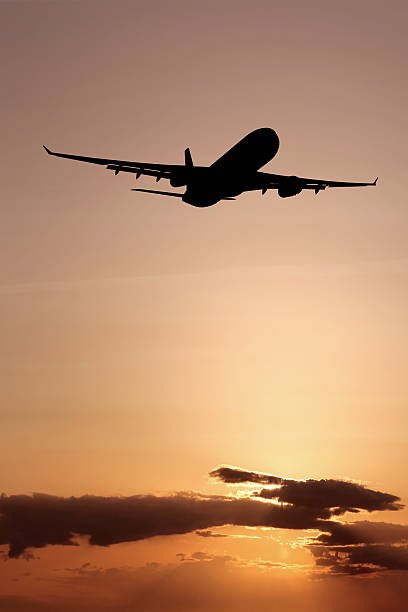 istock XL jet airplane taking off at dusk 136881643