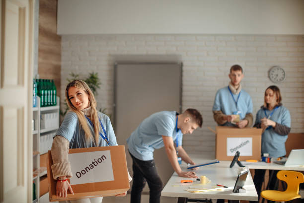 istock College students preparing donation in the box 1368816526