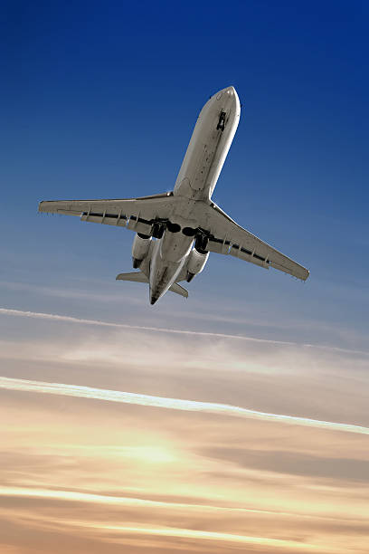 istock XL corporate jet airplane landing at dusk 136881669