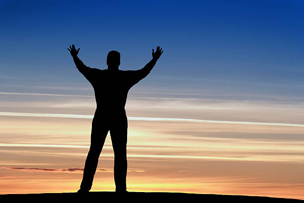 istock XXL reverent man silhouette 136881692