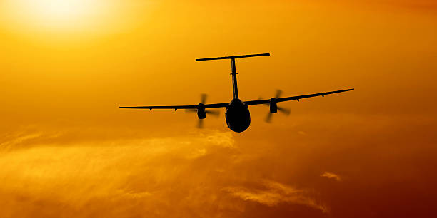 istock propeller airplane flying at sunset 136881703