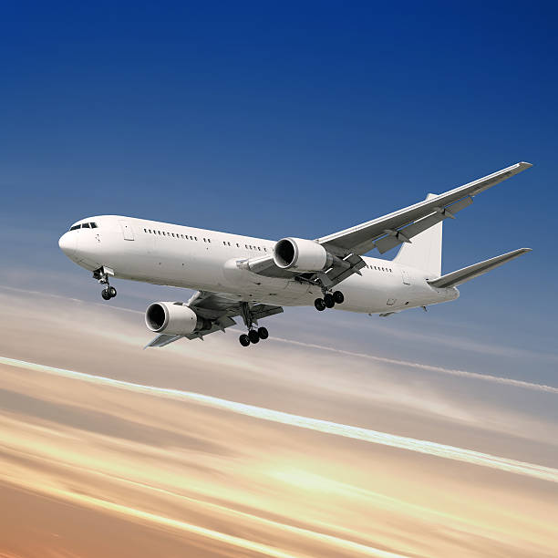 istock XXL jet airplane landing at dusk 136881736