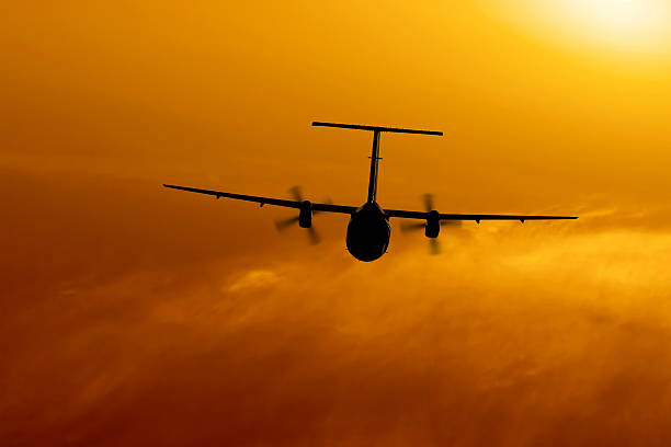 istock propeller airplane flying at sunset 136881770