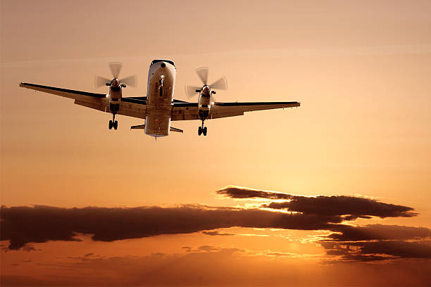 istock propeller airplane landing at dusk 136881796