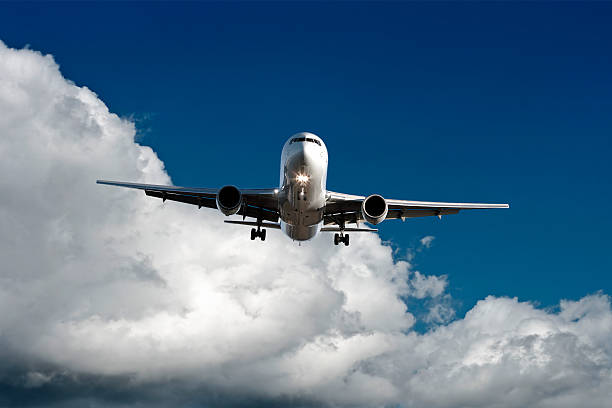 istock XL jet airplane landing in cloudy sky 136881820