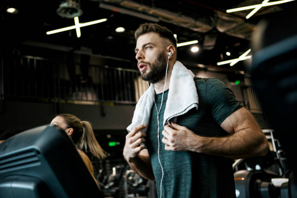istock Young man running in gym 1368818974