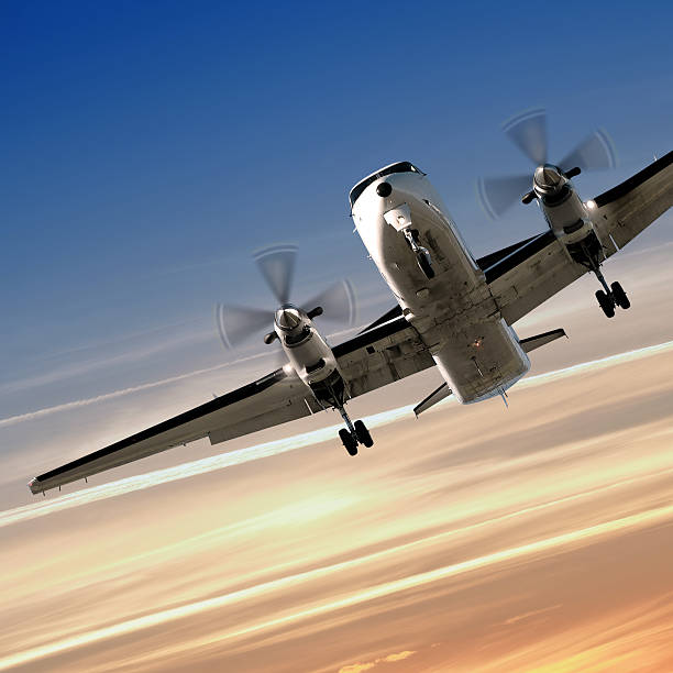 istock propeller airplane landing at dusk 136881967