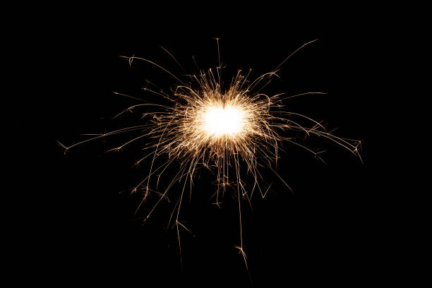istock Burning sparkler isolated on black background. Fireworks theme. Light effect and texture. 1368820202