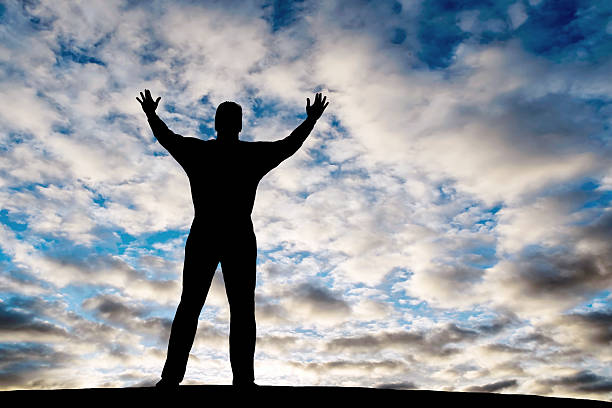 istock XXL reverent man silhouette 136882165