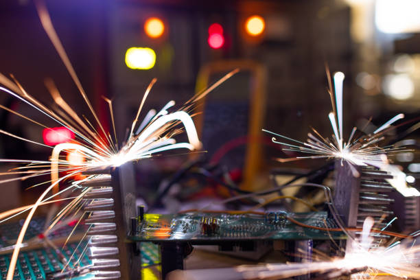 istock Microcircuit for TFT with wires sparkles with electric sparks 1368822176