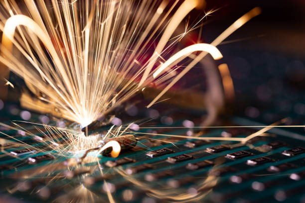istock Microcircuit for TFT with wires sparkles with electric sparks 1368822278