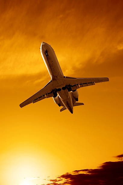 istock XXL corporate jet airplane landing at sunset 136882252
