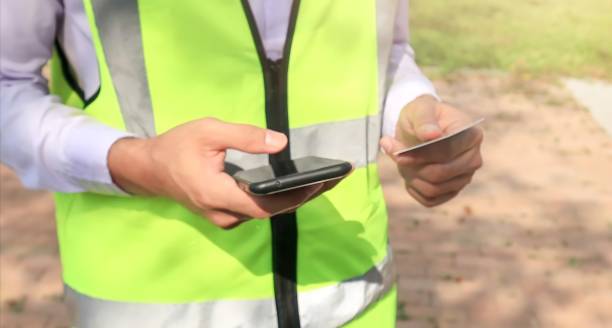 istock Engineer online shopping using a smartphone and credit card 1368822568
