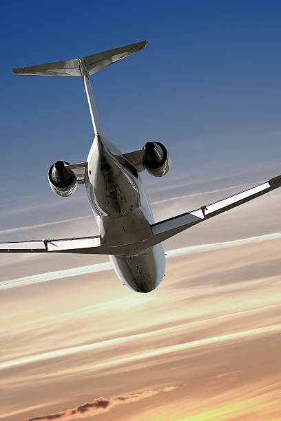 istock corporate jet airplane flying at dusk 136882423