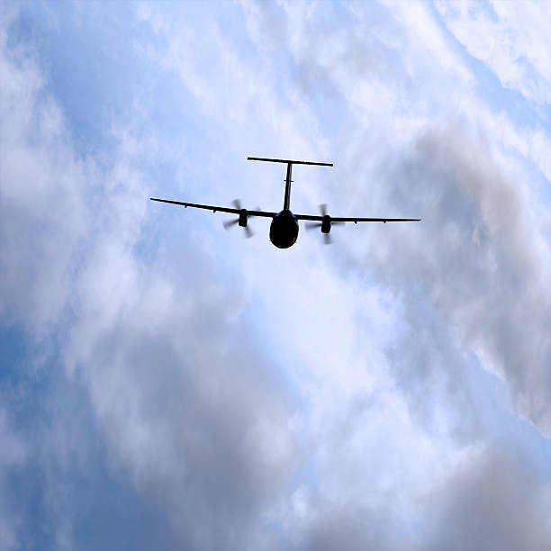 istock XL propeller airplane flying in storm 136882511