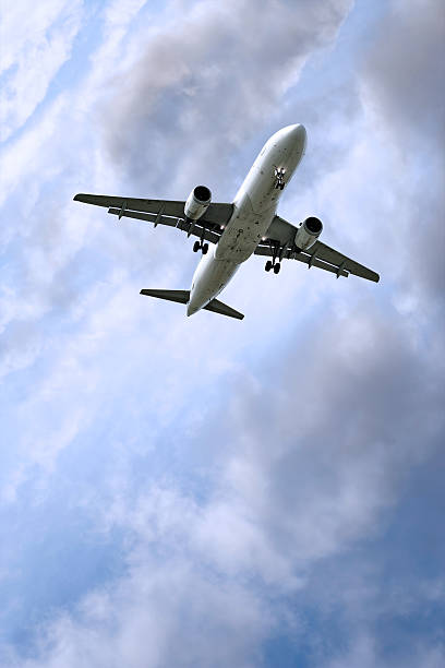 istock jet airplane landing in storm 136882567