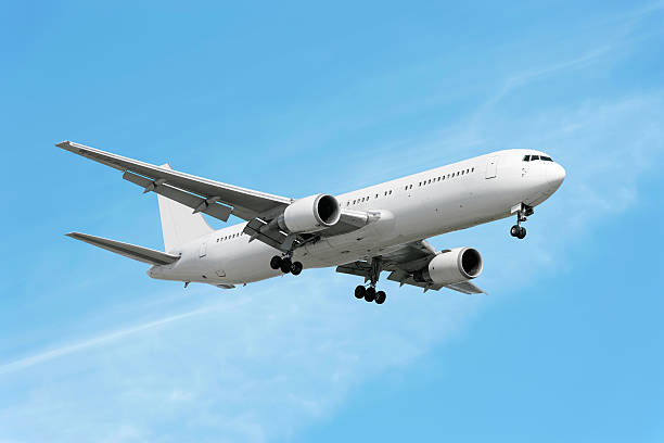 istock XXL jet airplane landing in bright sky 136882742