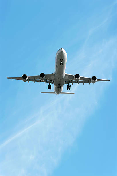 istock XXL jet airplane landing in bright sky 136882758
