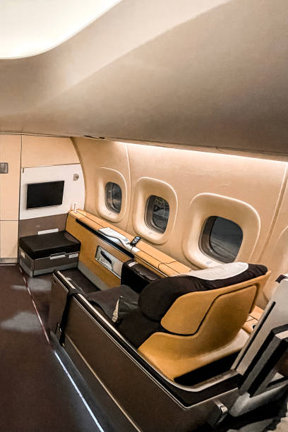 istock First business class seat in airplane 1368827908