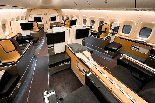 First class with luxurious interiors seen in an empty airplane.