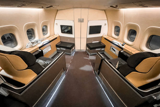 istock First business class seat in airplane 1368827919