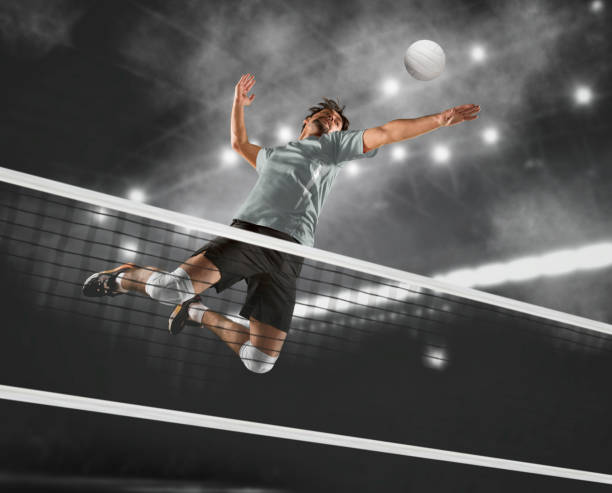 Volleyball player players in action stock photo