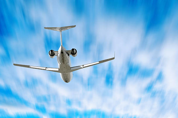 istock corporate jet airplane flying in motion blur sky 136882836