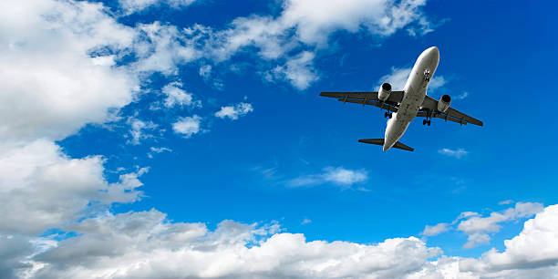 istock jet airplane landing in bright sky 136882891