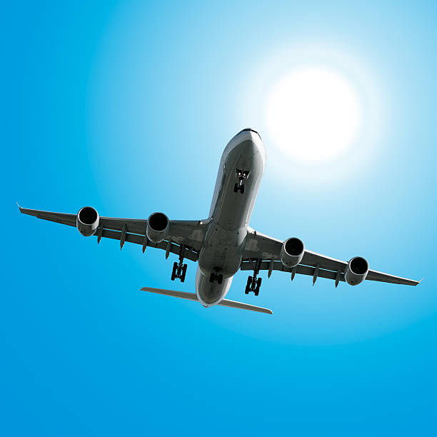 istock jet airplane landing in bright sky 136882893