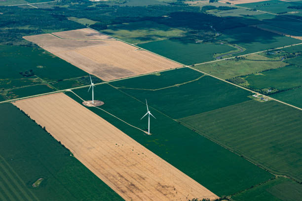 Wind turbines and agricultural field stock photo