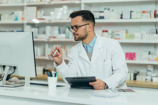istock Portrait of a handsome pharmacist working in a pharmacy 1368830724