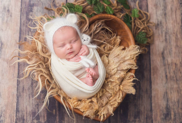 istock A newborn baby dressed in a mouse costume is sleeping 1368835846