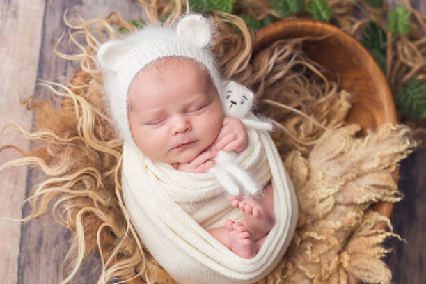 istock A newborn baby dressed in a mouse costume is sleeping 1368835855