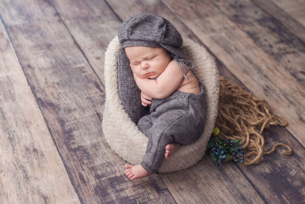 istock A newborn baby dressed in a gnome costume is sleeping 1368835876