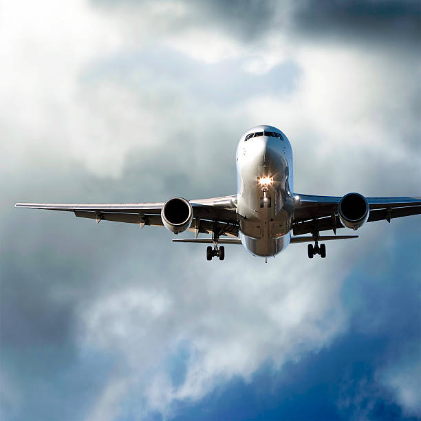 istock jet airplane landing in storm 136884176