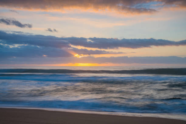 Sunrise seascape with clouds at Killcare Beach on the Central Coast, NSW, Australia.