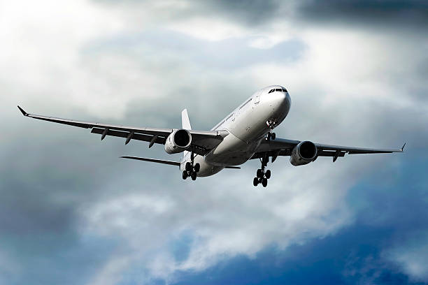 istock jet airplane landing in storm 136884233
