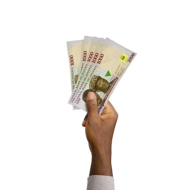 Black Hand holding 3D rendered Nigerian Naira notes Black Hand holding 3D rendered Nigerian Naira notes ghana photos stock pictures, royalty-free photos & images