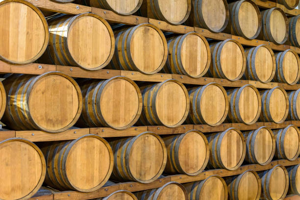 istock Wooden barrels in the wine cellar 1368843571