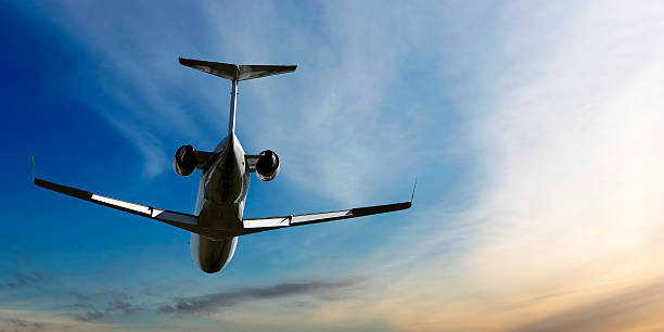 istock corporate jet airplane flying at dusk 136884404