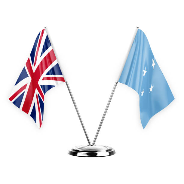 istock Two table flags isolated on white background 3d illustration, united kingdom and micronesia 1368844250