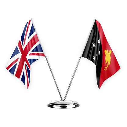 Two table flags isolated on white background 3d illustration, united kingdom and papua new guinea